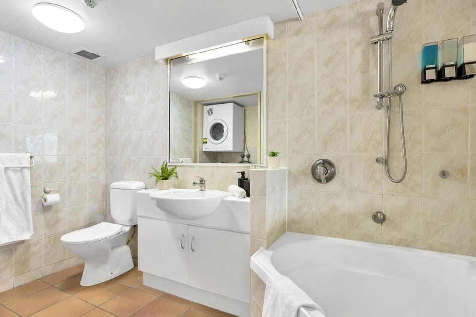 Shower, Toilet, Bathroom, Bath, hair dryier, towels, washing machine, dryer
