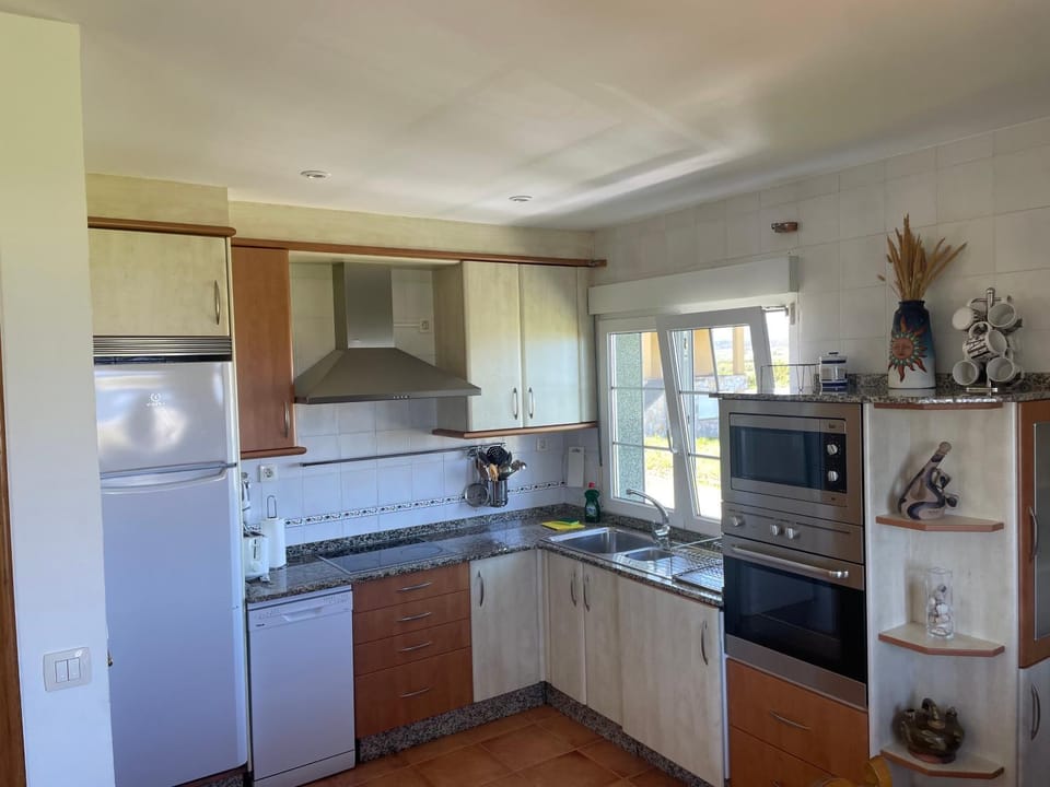 Kitchen or kitchenette, dishwasher, oven, stove