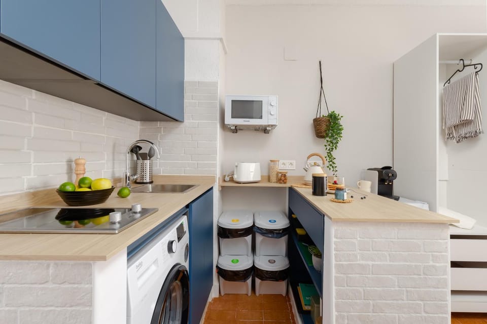 Kitchen or kitchenette, stove, toaster, washing machine