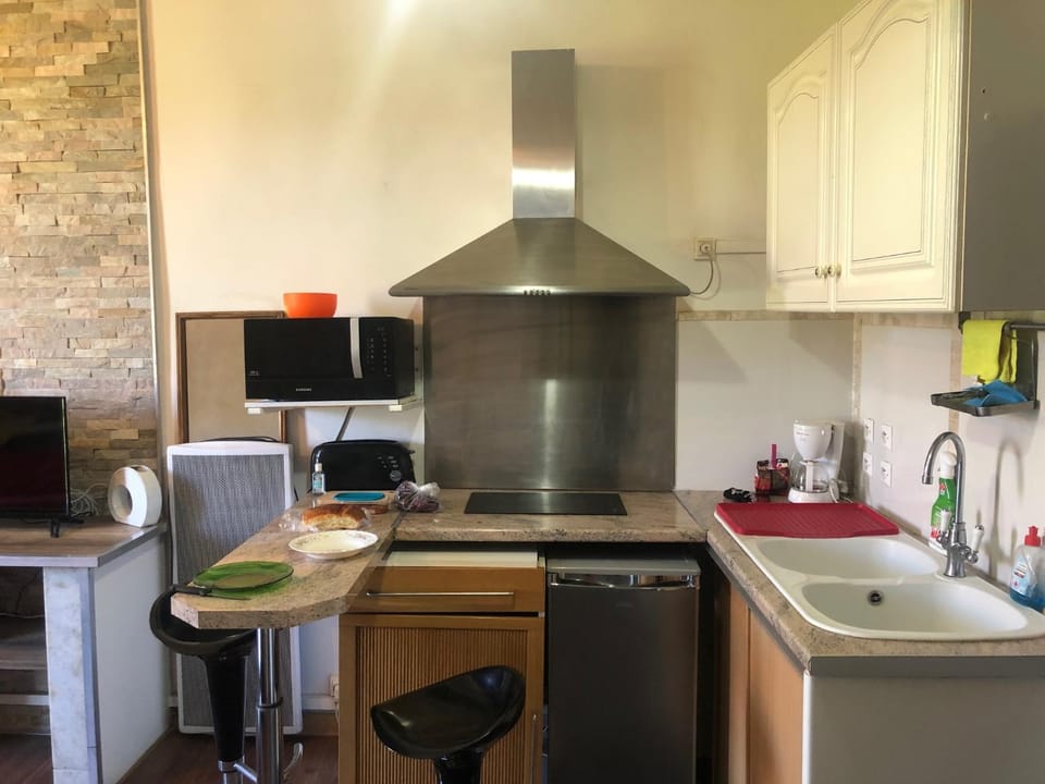 Kitchen or kitchenette, stove, toaster