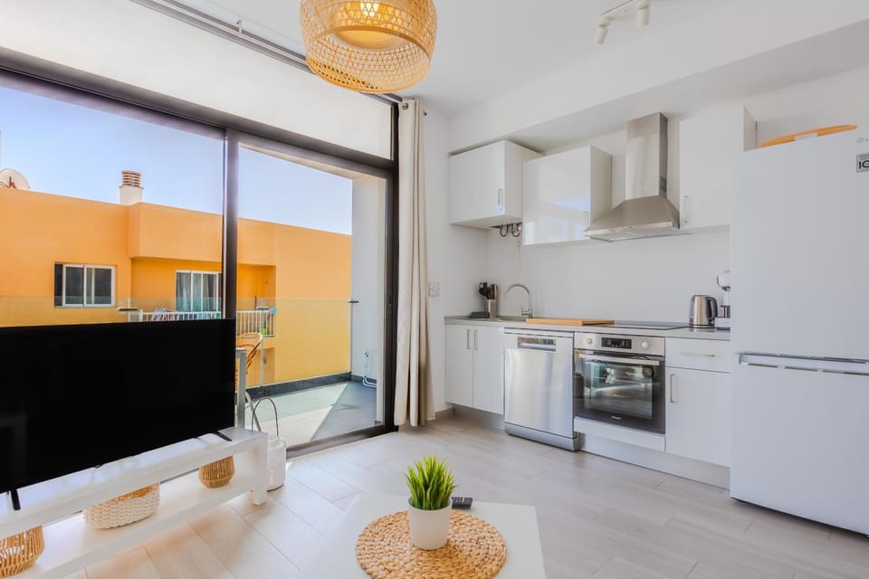 Kitchen or kitchenette, dishwasher, oven, stove