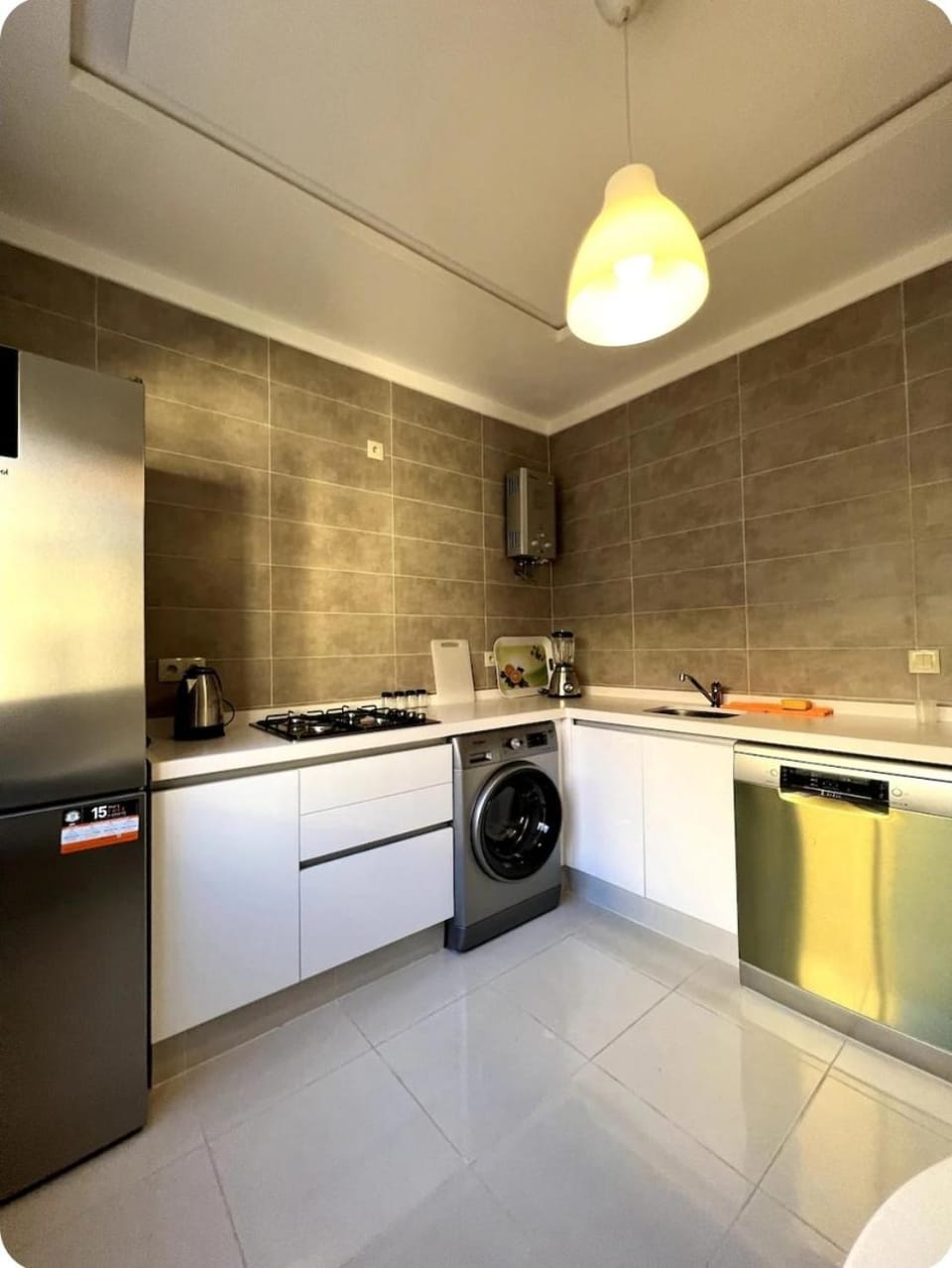 Kitchen or kitchenette, dishwasher, stove, washing machine