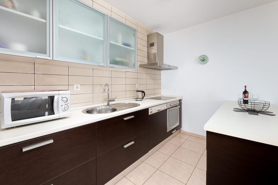 Kitchen or kitchenette, dishwasher, oven, stove, toaster