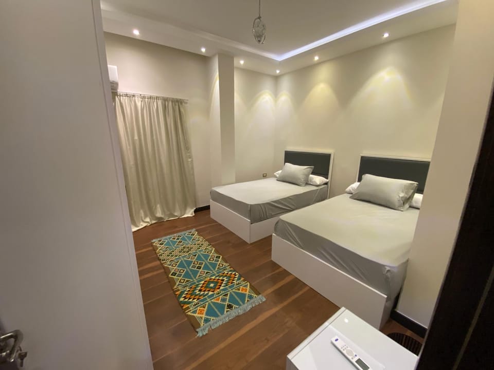 Bed, Photo of the whole room, Bedroom, towels, air conditioner, air conditioner