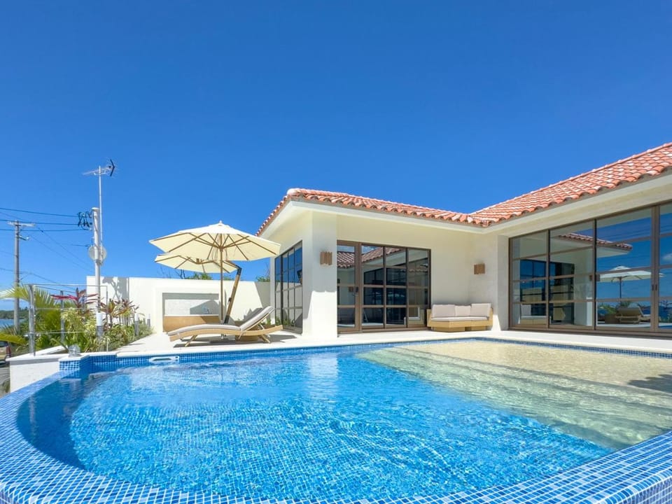 Property building, Day, Pool view, sunbed