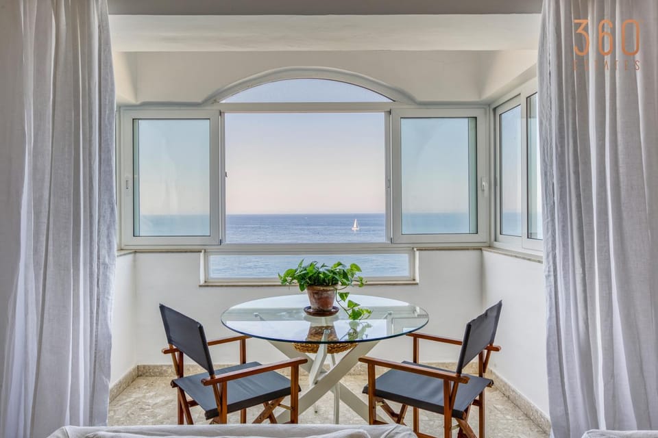 Natural landscape, Living room, Seating area, Dining area, Sea view