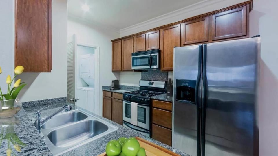 Kitchen or kitchenette, dishwasher, oven, stove, toaster, washing machine, dryer