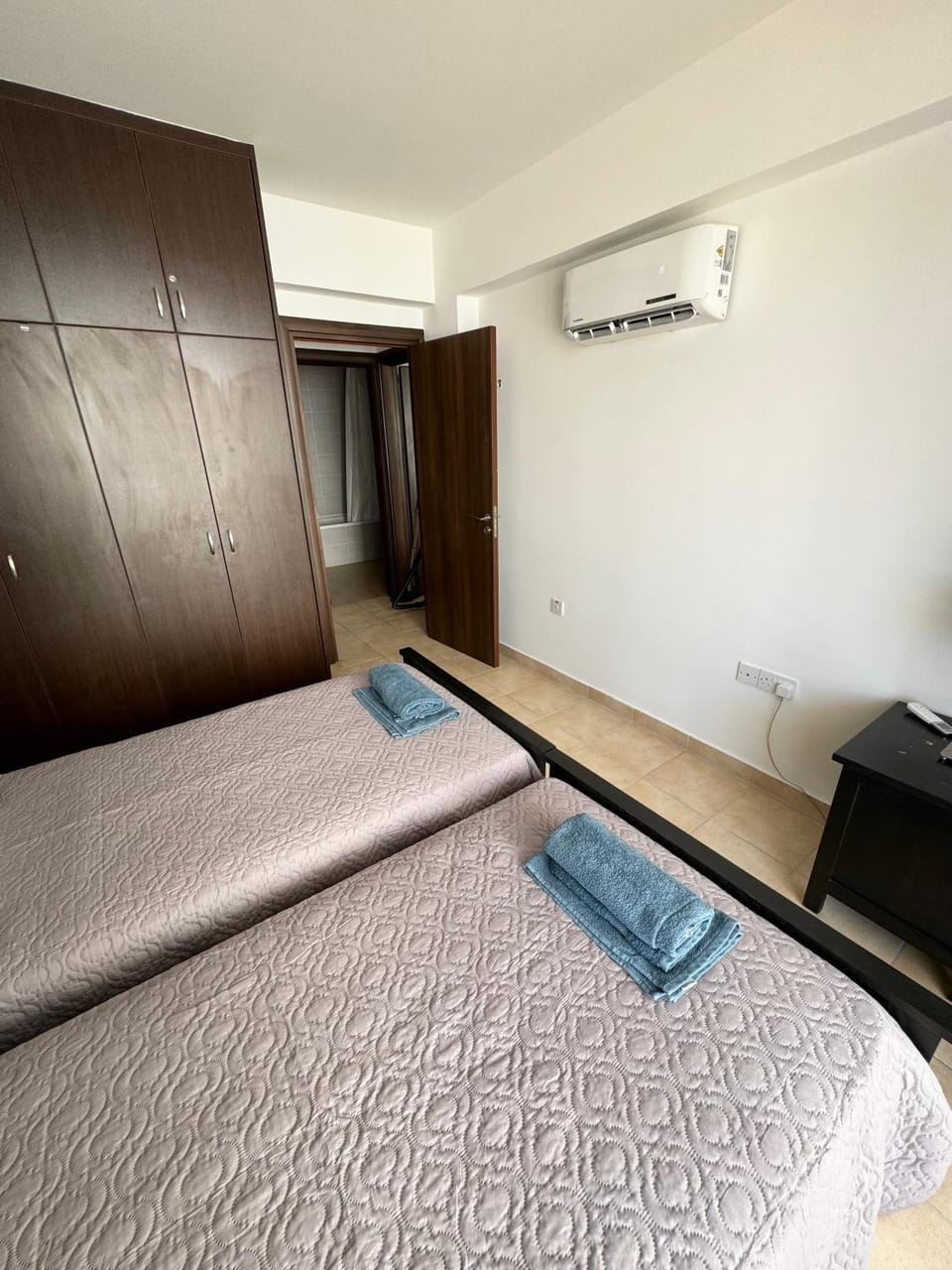 Bed, Photo of the whole room, Bedroom, towels, wardrobe, air conditioner