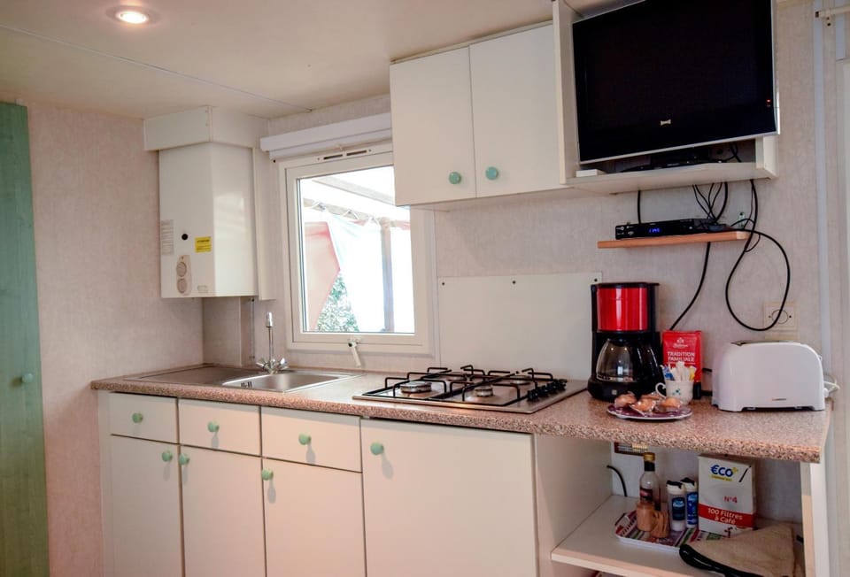 Kitchen or kitchenette, stove, toaster