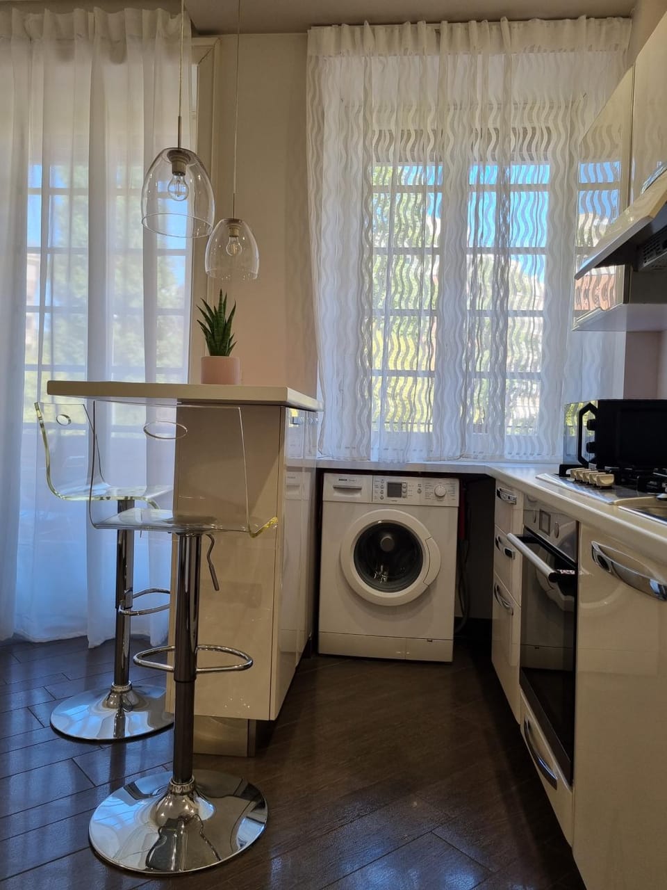 Kitchen or kitchenette, dishwasher, stove, washing machine