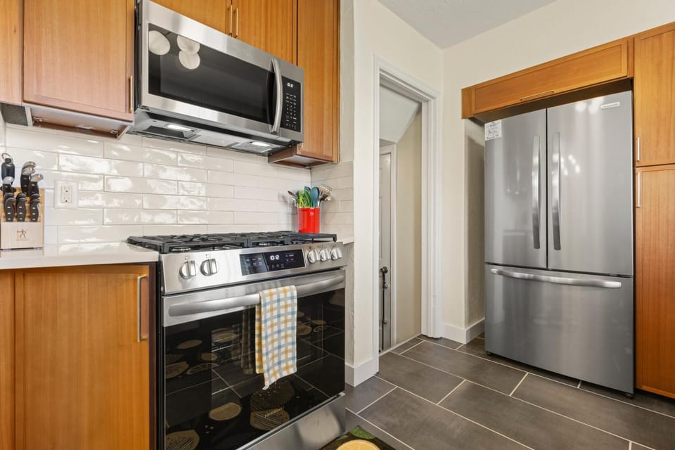 Kitchen or kitchenette, dishwasher, oven, stove