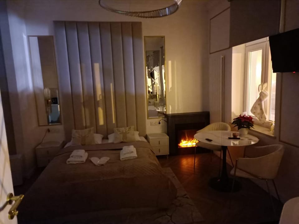 Bed, Bedroom, fireplace, towels