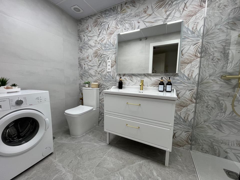 Toilet, Bathroom, towels, washing machine, dryer