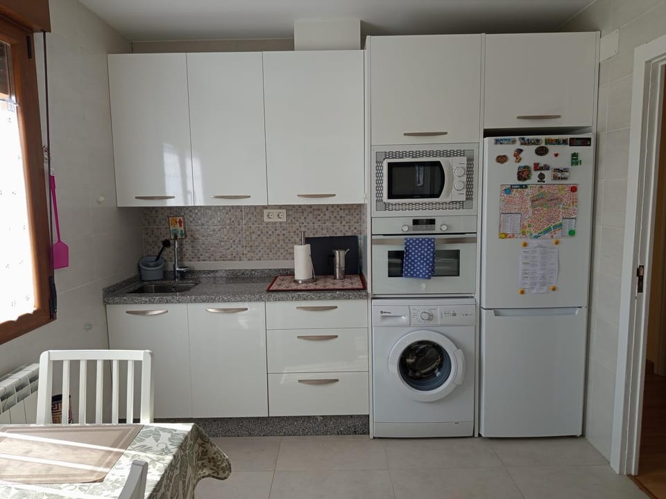Kitchen or kitchenette, dishwasher, oven, stove, toaster, washing machine