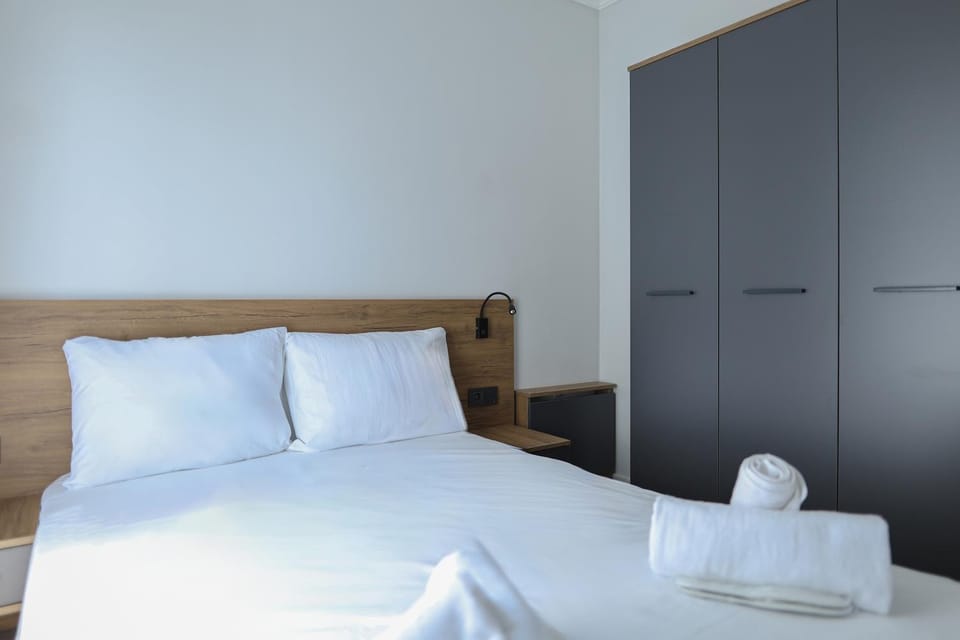 Bed, towels, wardrobe