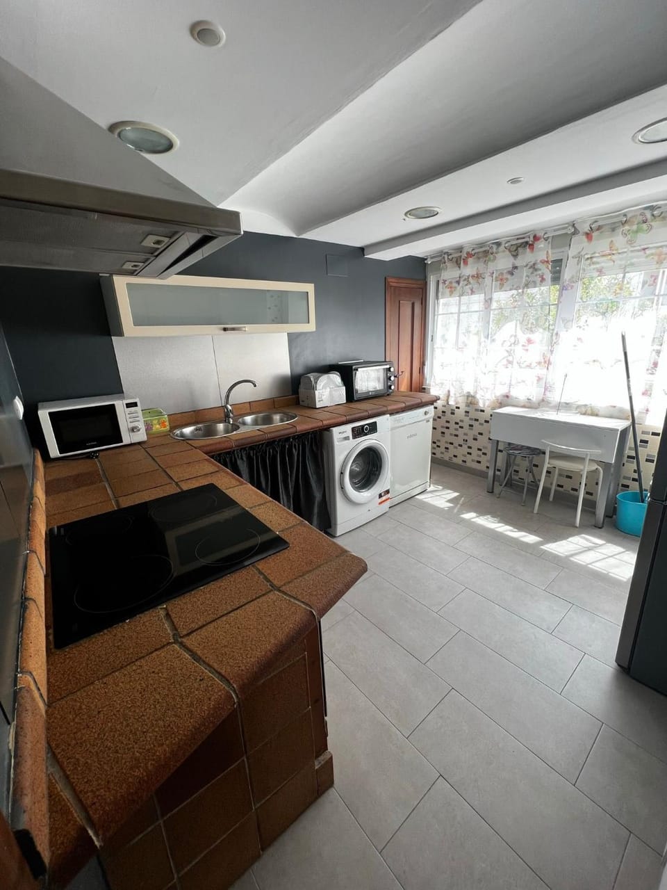 Kitchen or kitchenette, dishwasher, stove, washing machine