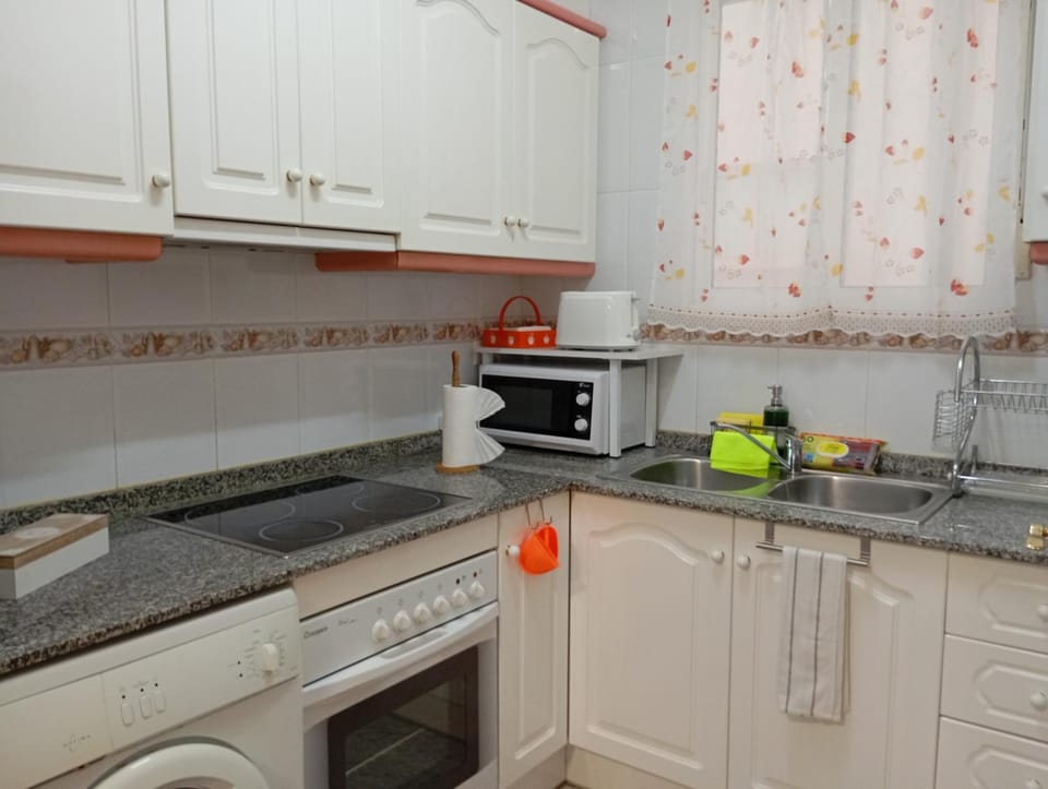 microwave, oven, stove, toaster, washing machine, kitchen