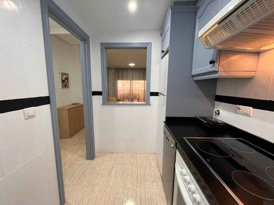 Kitchen or kitchenette, dishwasher, oven, stove