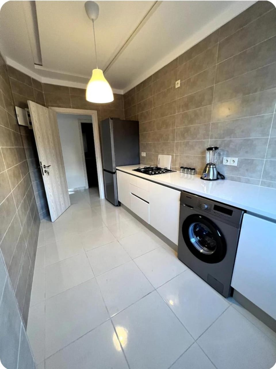 Kitchen or kitchenette, dishwasher, stove, washing machine