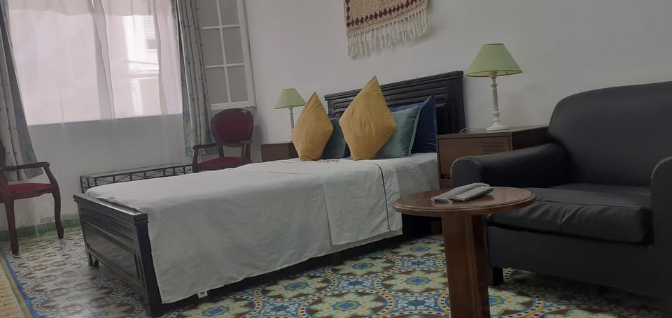 Bed, Seating area, Bedroom