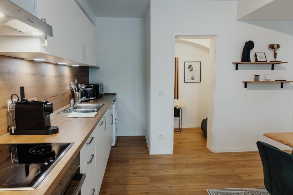 Kitchen or kitchenette, dishwasher, oven, stove, toaster