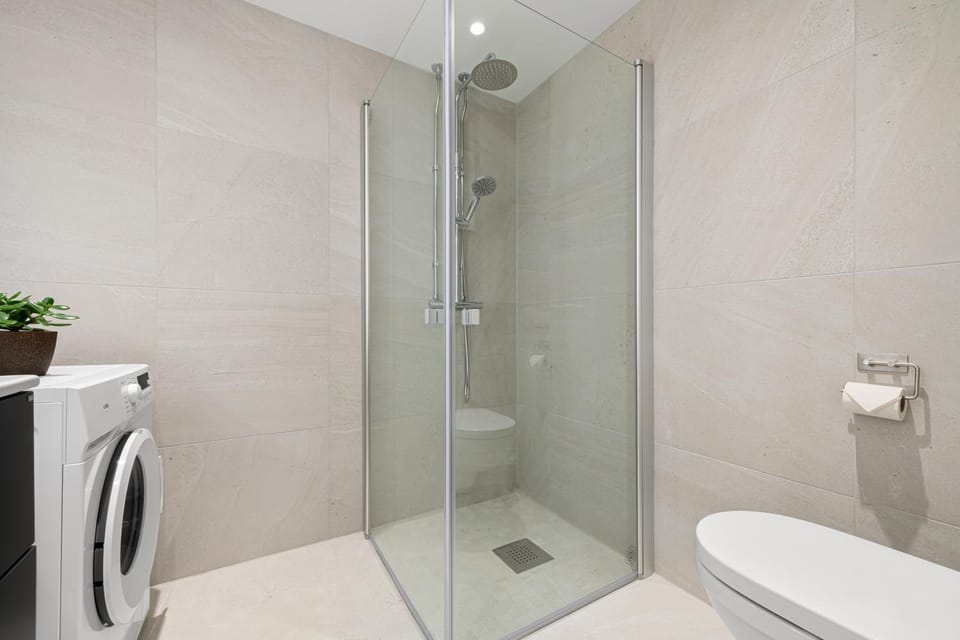 Shower, Toilet, Bathroom, towels, washing machine, dryer