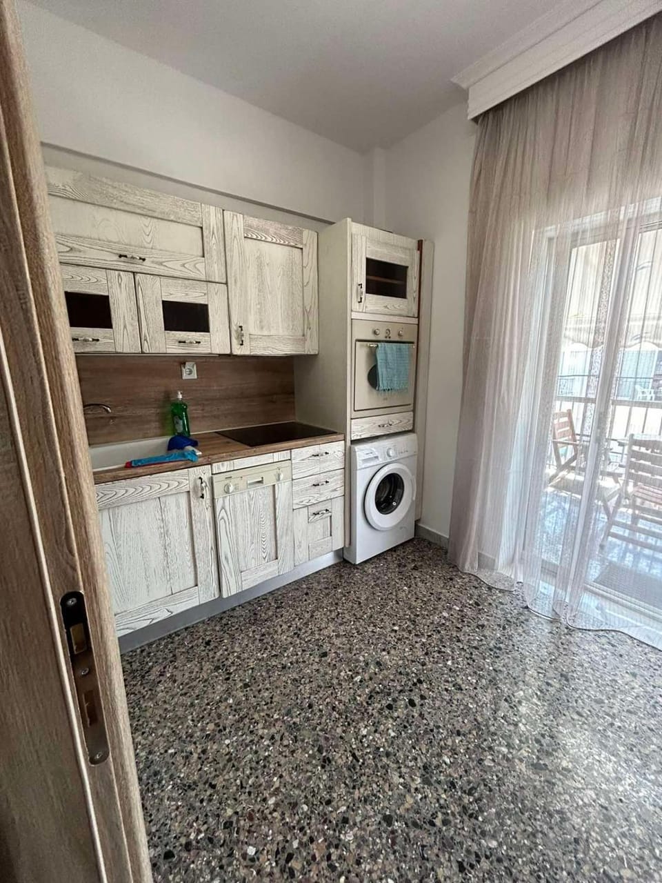 Kitchen or kitchenette, dishwasher, oven, stove, washing machine