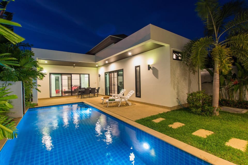 Property building, Patio, Night, Swimming pool, sunbed