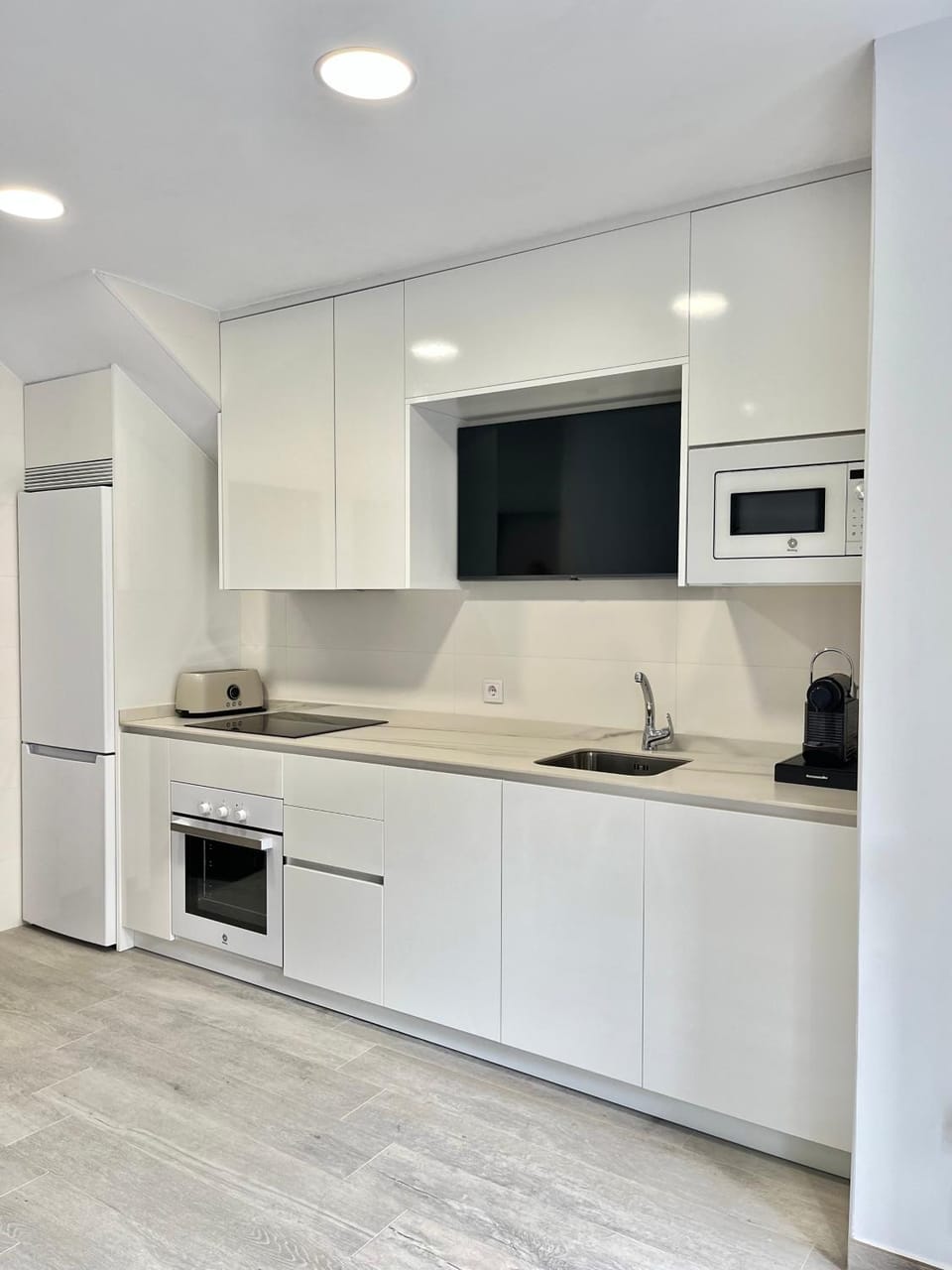 Kitchen or kitchenette, dishwasher, oven, stove