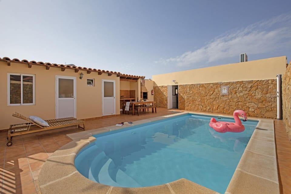 Property building, Living room, Swimming pool