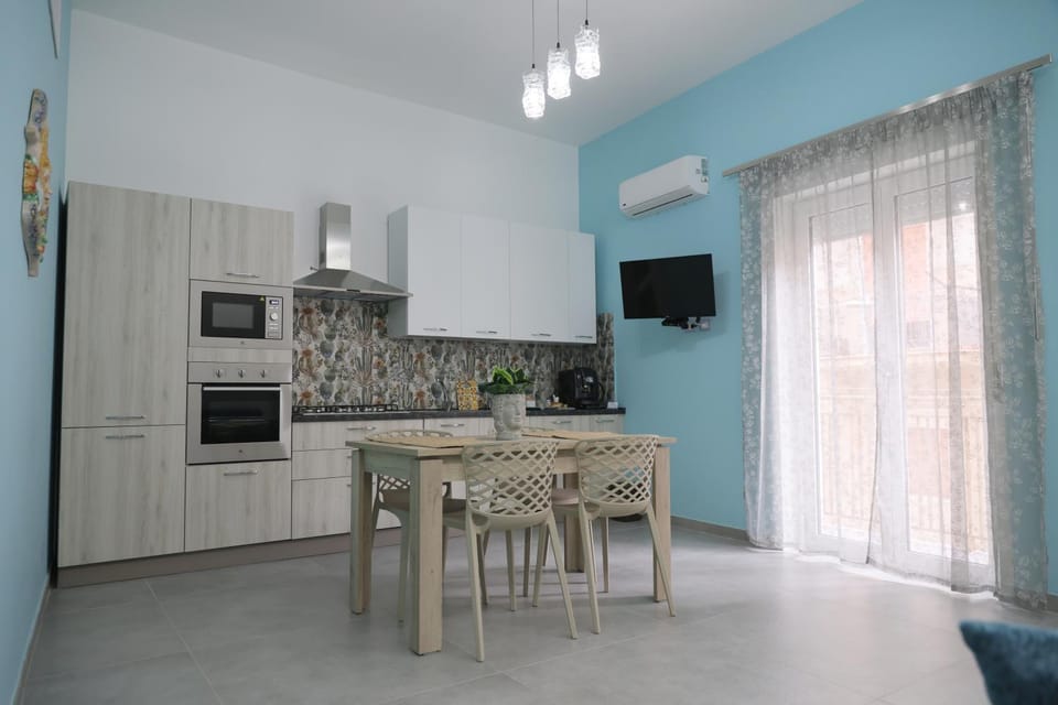 TV and multimedia, Balcony/Terrace, Kitchen or kitchenette, Decorative detail, microwave, oven, kitchen, air conditioner