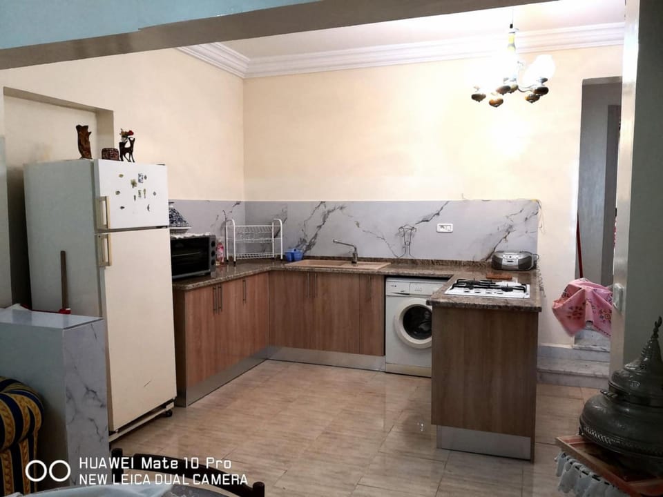 Kitchen or kitchenette, washing machine