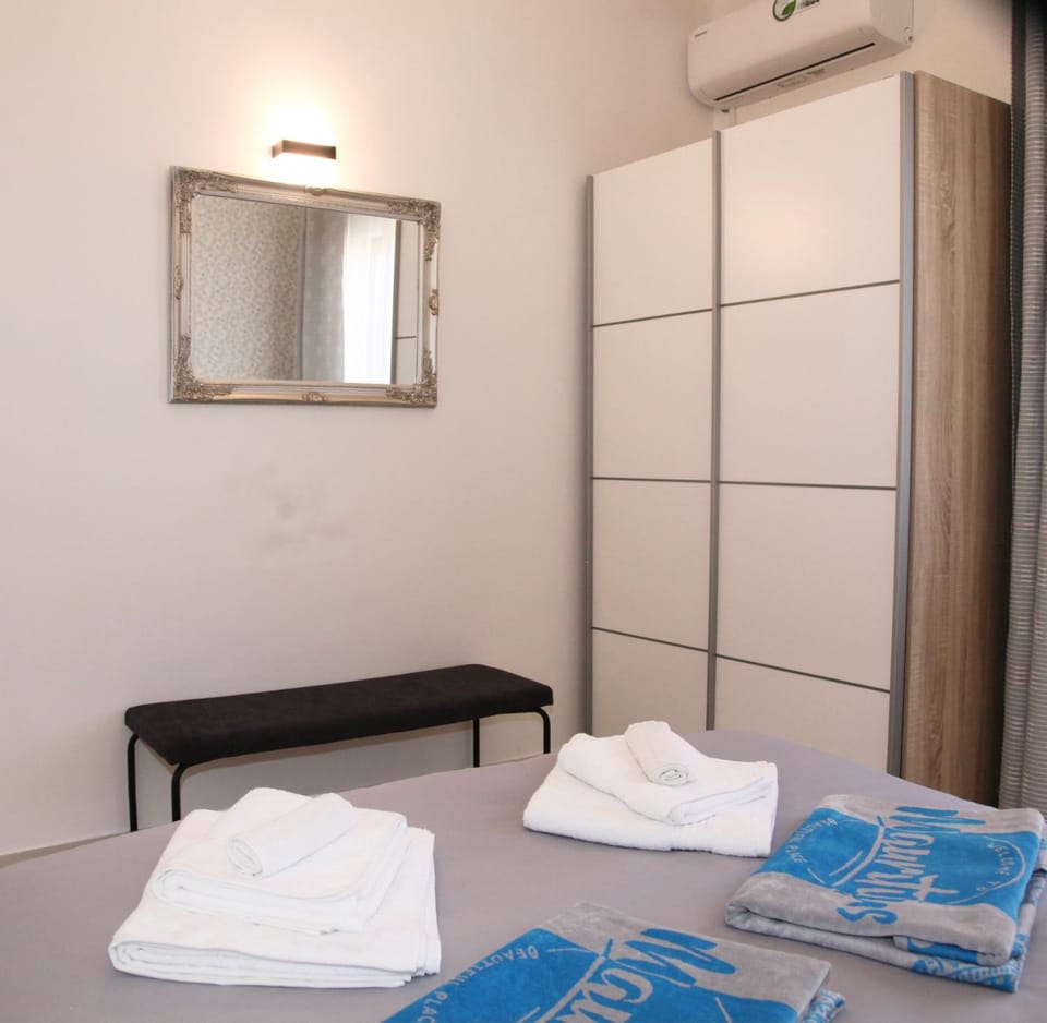 Bedroom, towels, wardrobe, air conditioner