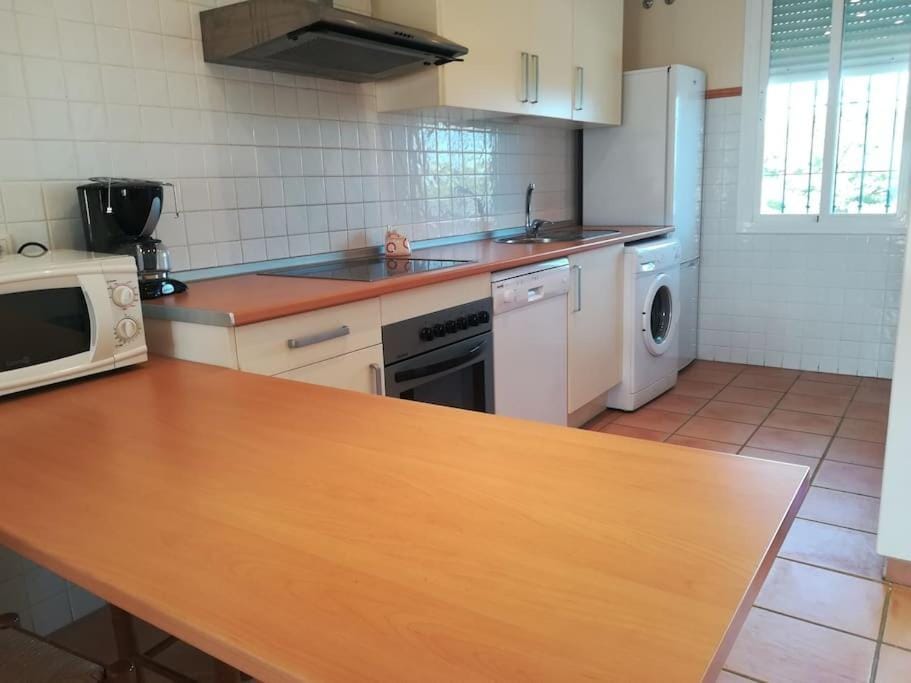 Kitchen or kitchenette, dishwasher, oven, stove, toaster