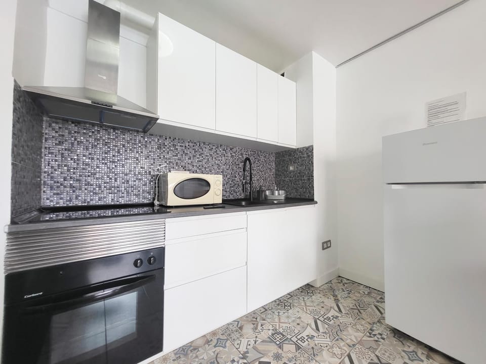Kitchen or kitchenette, oven, stove, toaster