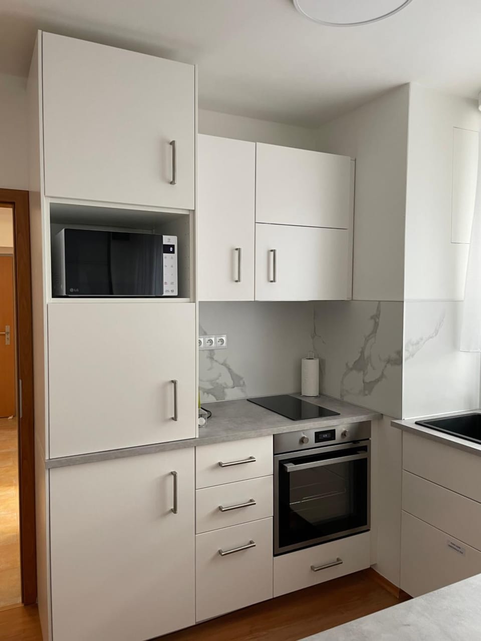 Kitchen or kitchenette, microwave, oven, stove