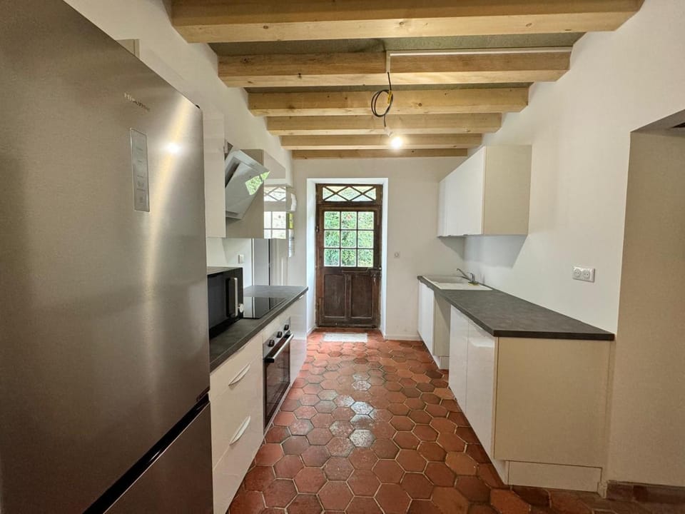 Kitchen or kitchenette, dishwasher, oven, stove