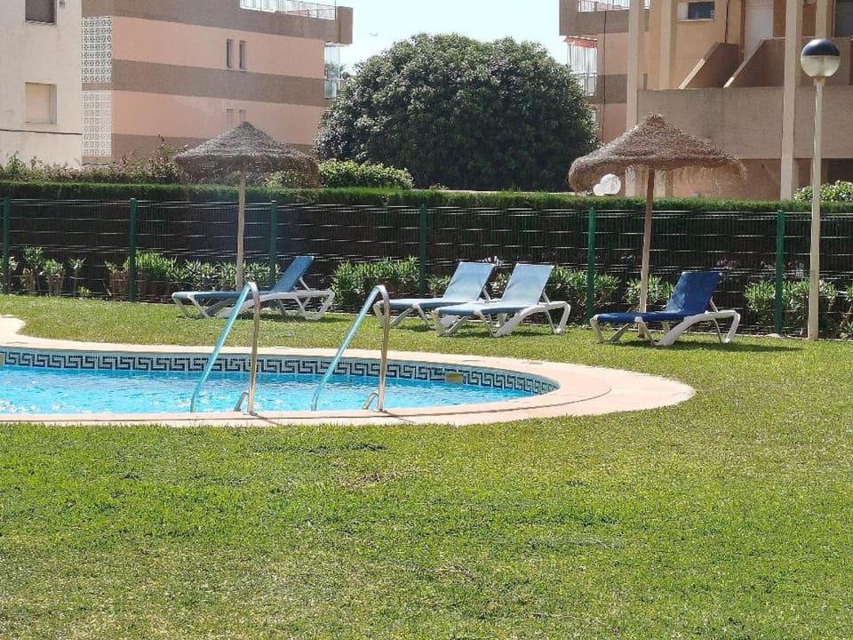 Swimming pool, sunbed