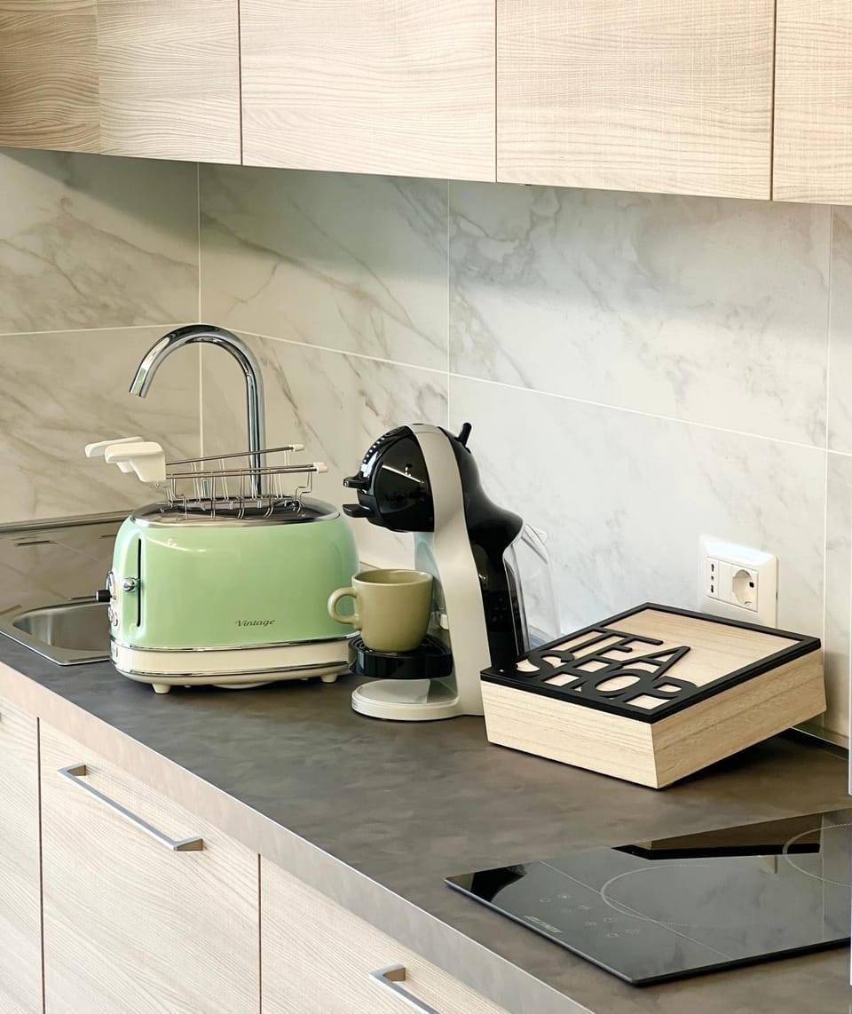 Kitchen or kitchenette, stove, toaster