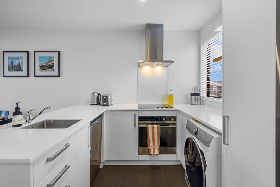 Kitchen or kitchenette, dishwasher, oven, stove, washing machine, dryer