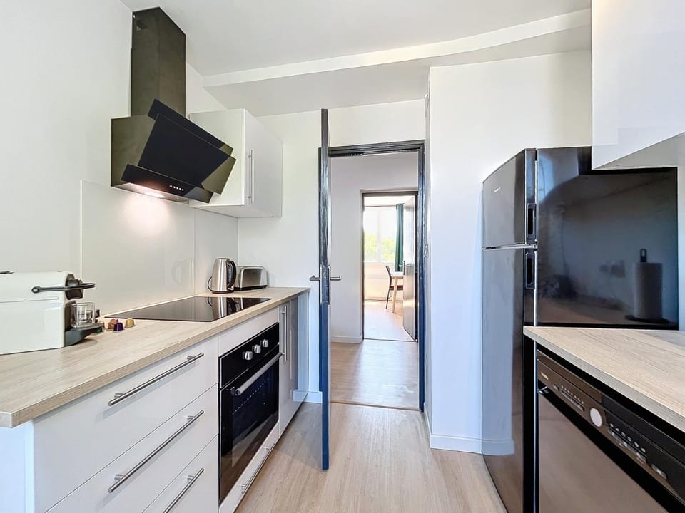 Kitchen or kitchenette, dishwasher, oven, stove, toaster