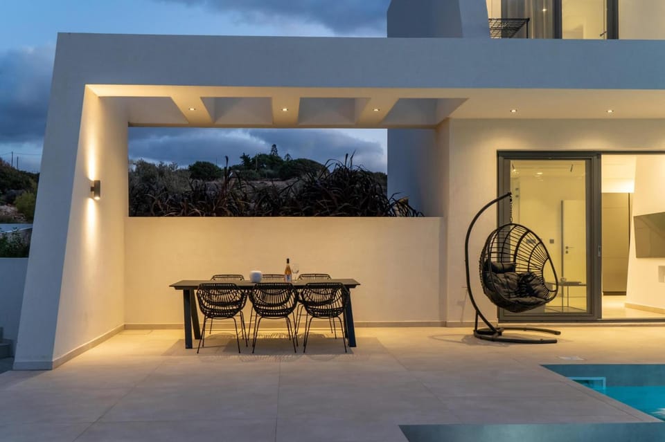 Patio, Night, Seating area, Pool view, Swimming pool, sunbed