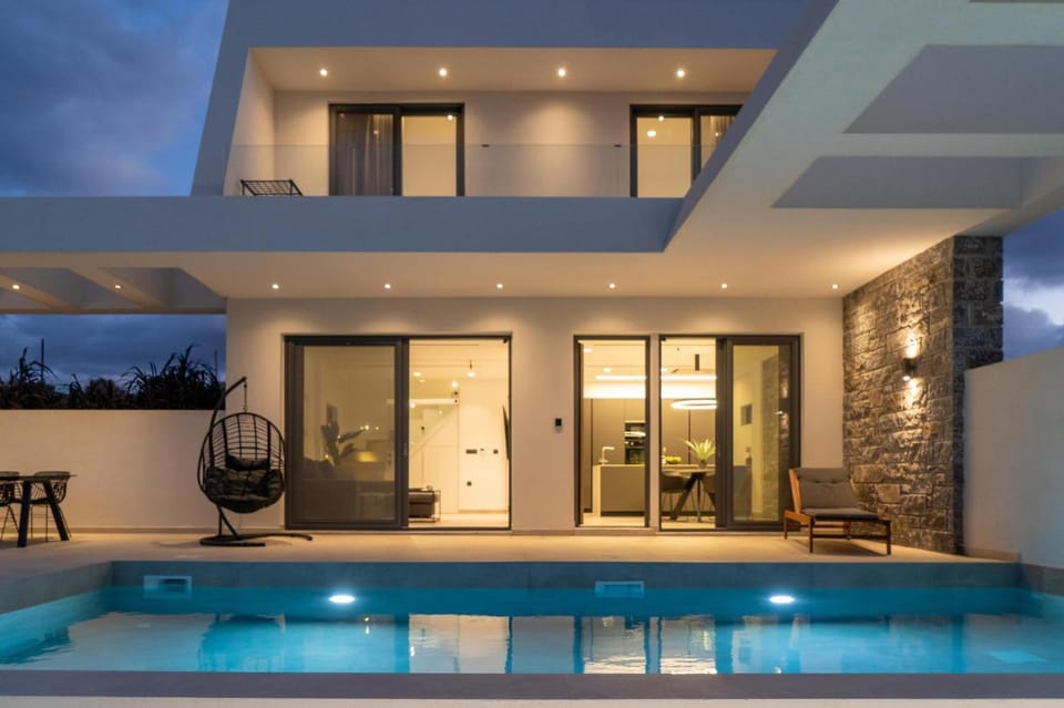 Property building, Patio, Night, Pool view, Swimming pool, sunbed