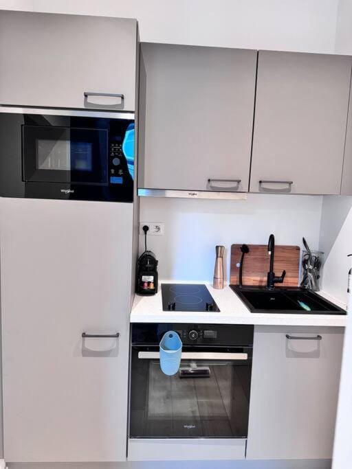 Kitchen or kitchenette, oven, stove