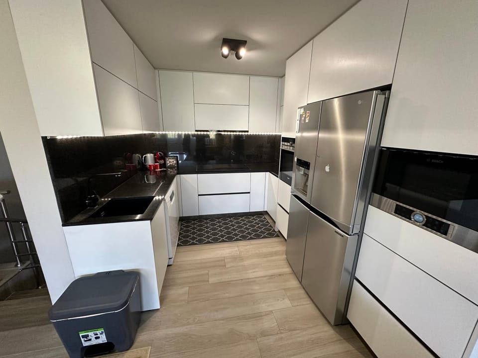 Kitchen or kitchenette, dishwasher, microwave, oven, stove
