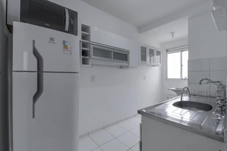 Kitchen or kitchenette, microwave, oven, stove
