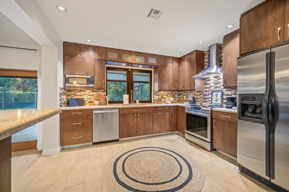 Kitchen or kitchenette, dishwasher, oven, stove