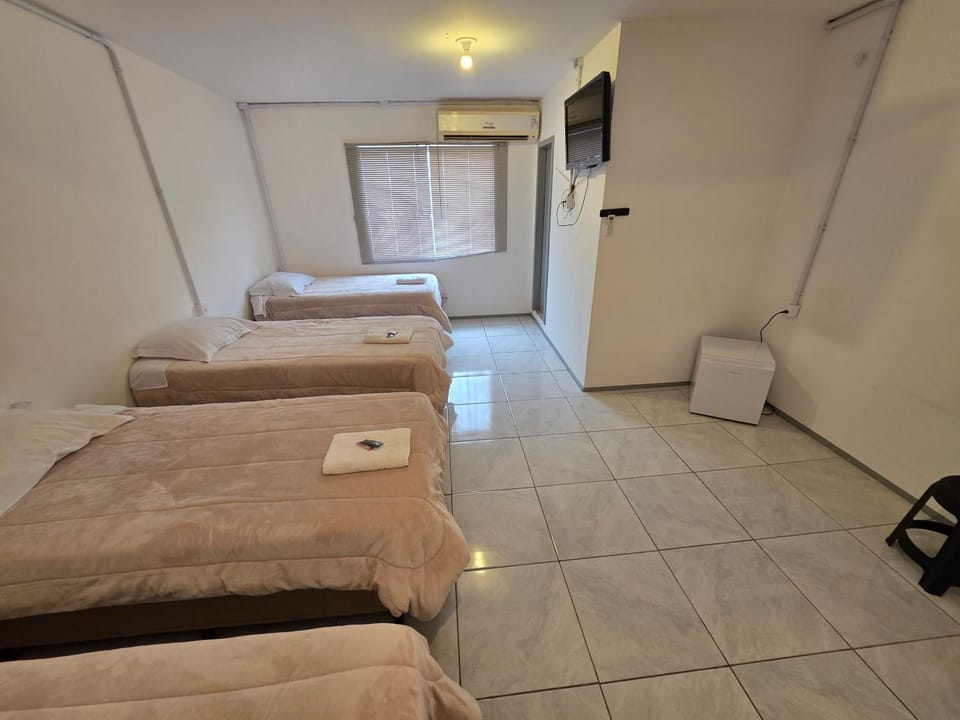 Photo of the whole room, towels, air conditioner