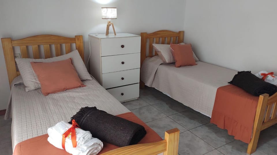 Bed, Photo of the whole room, Bedroom, Text overlay, towels