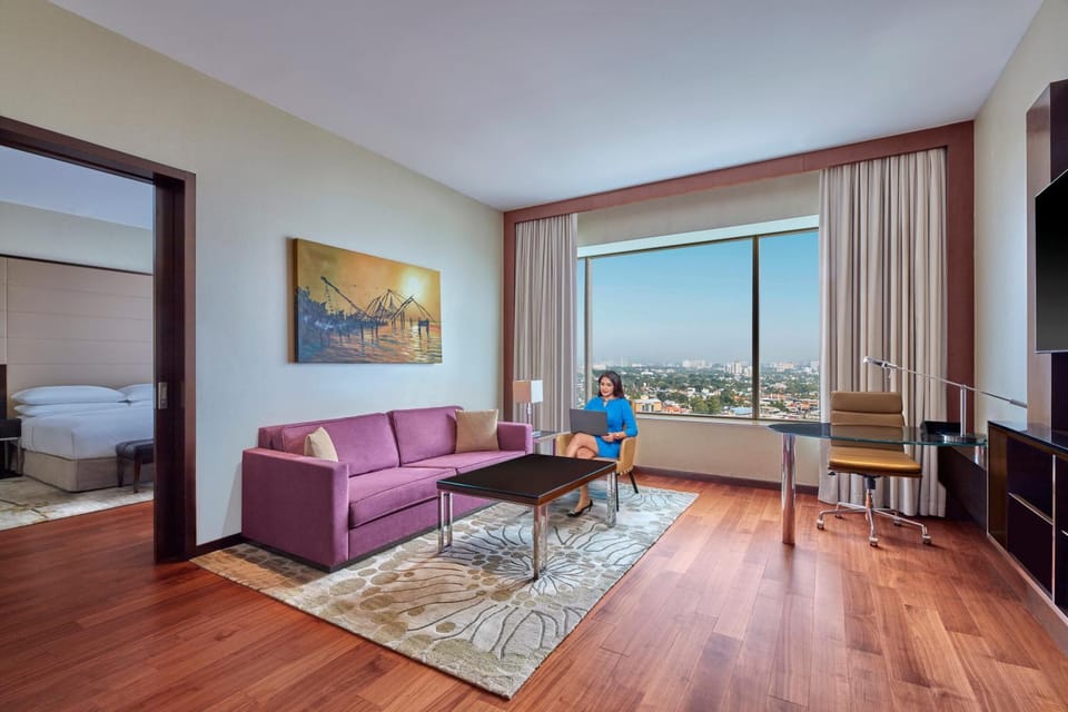 Bed, TV and multimedia, Living room, Seating area, Bedroom, City view